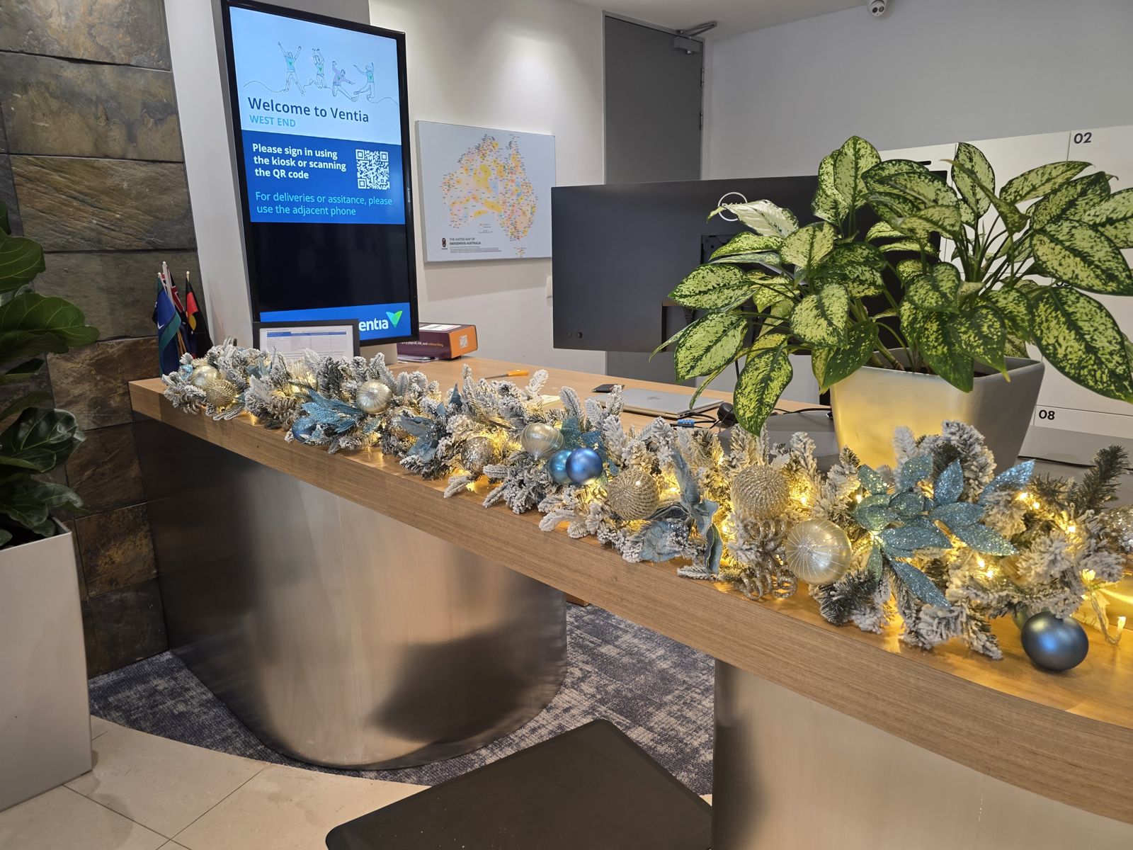 Festive garland styled along an office reception desk
