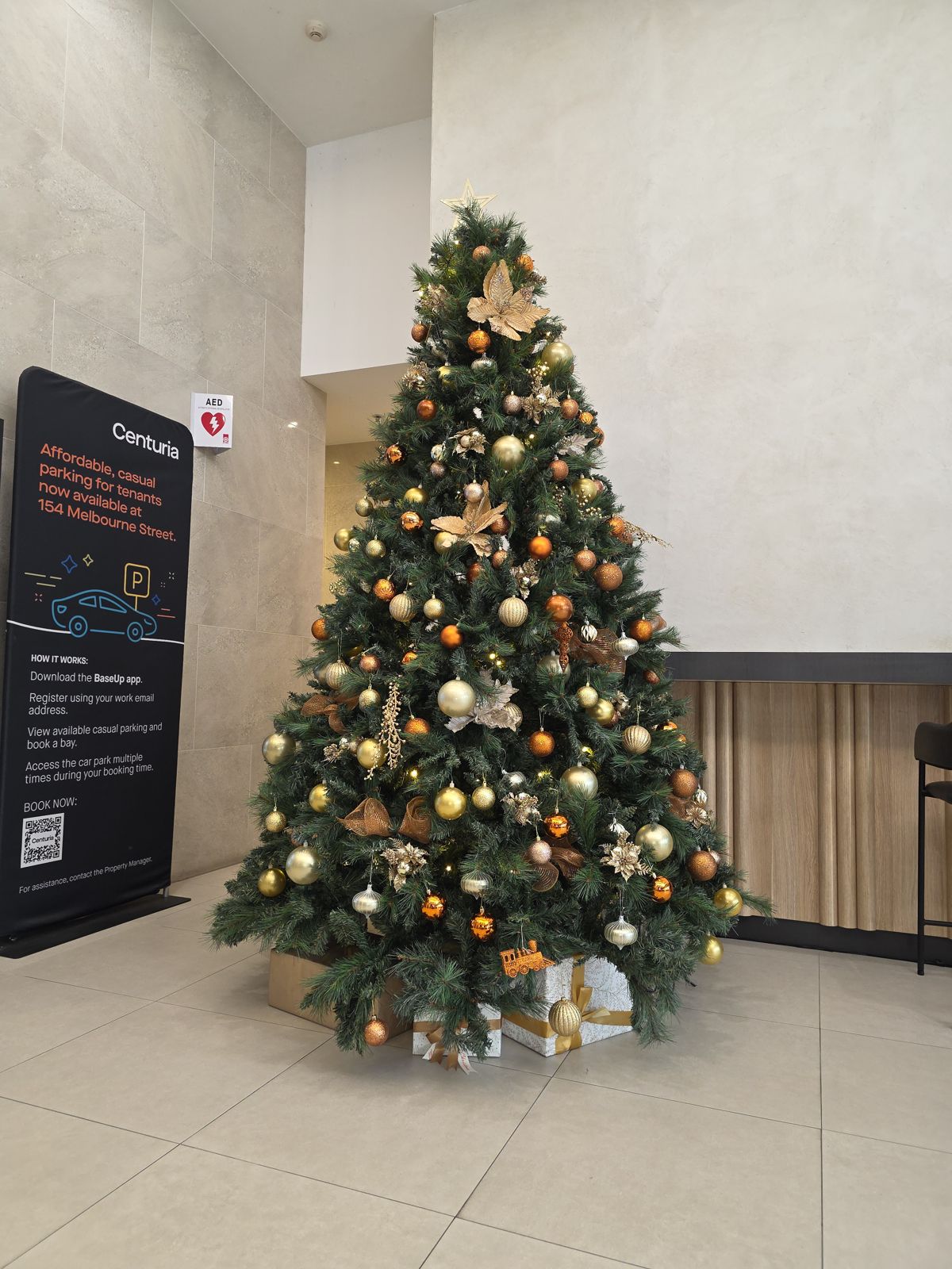 Gold and copper tree in a tower lobby