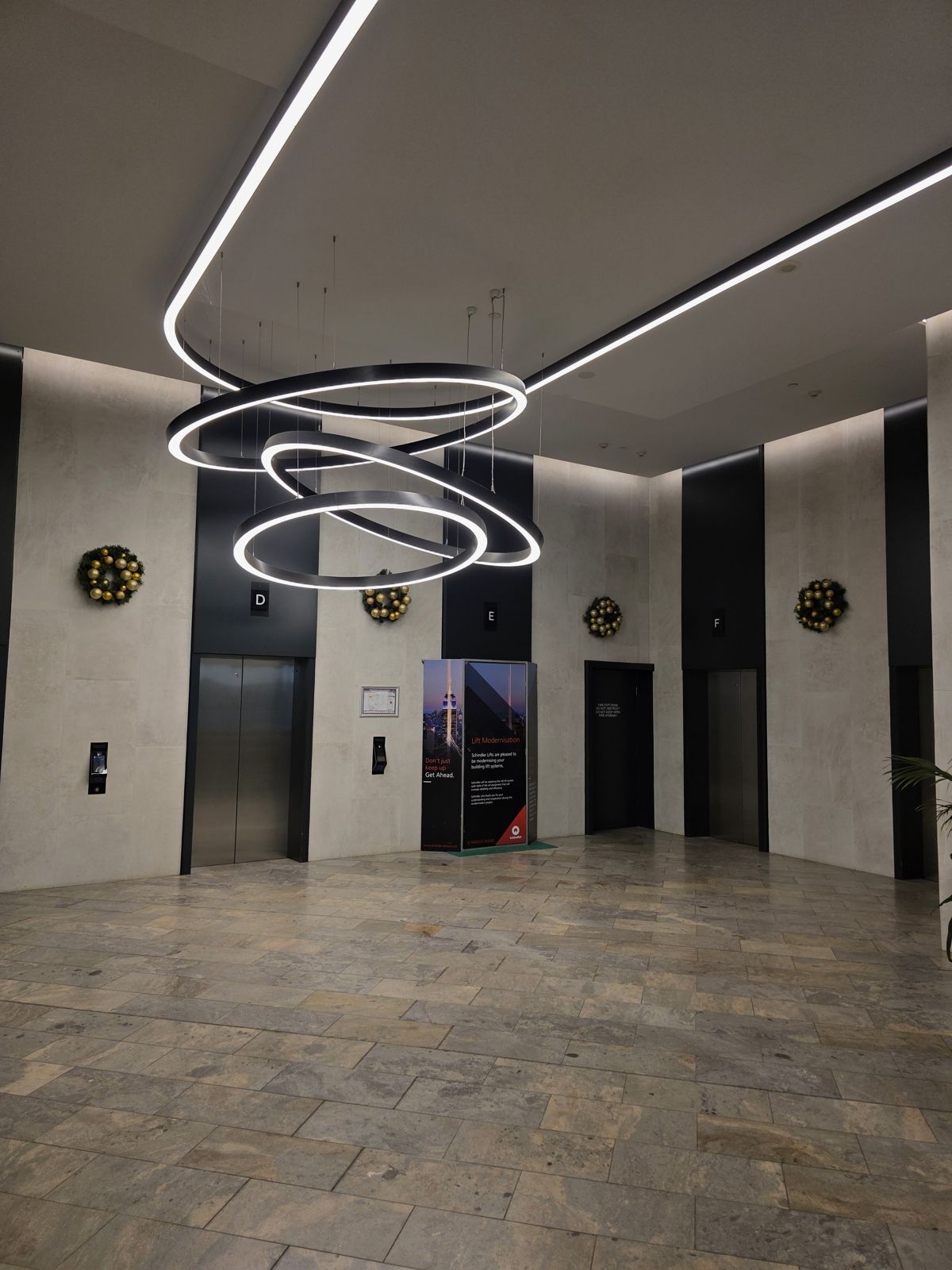 Wreaths through a lift lobby