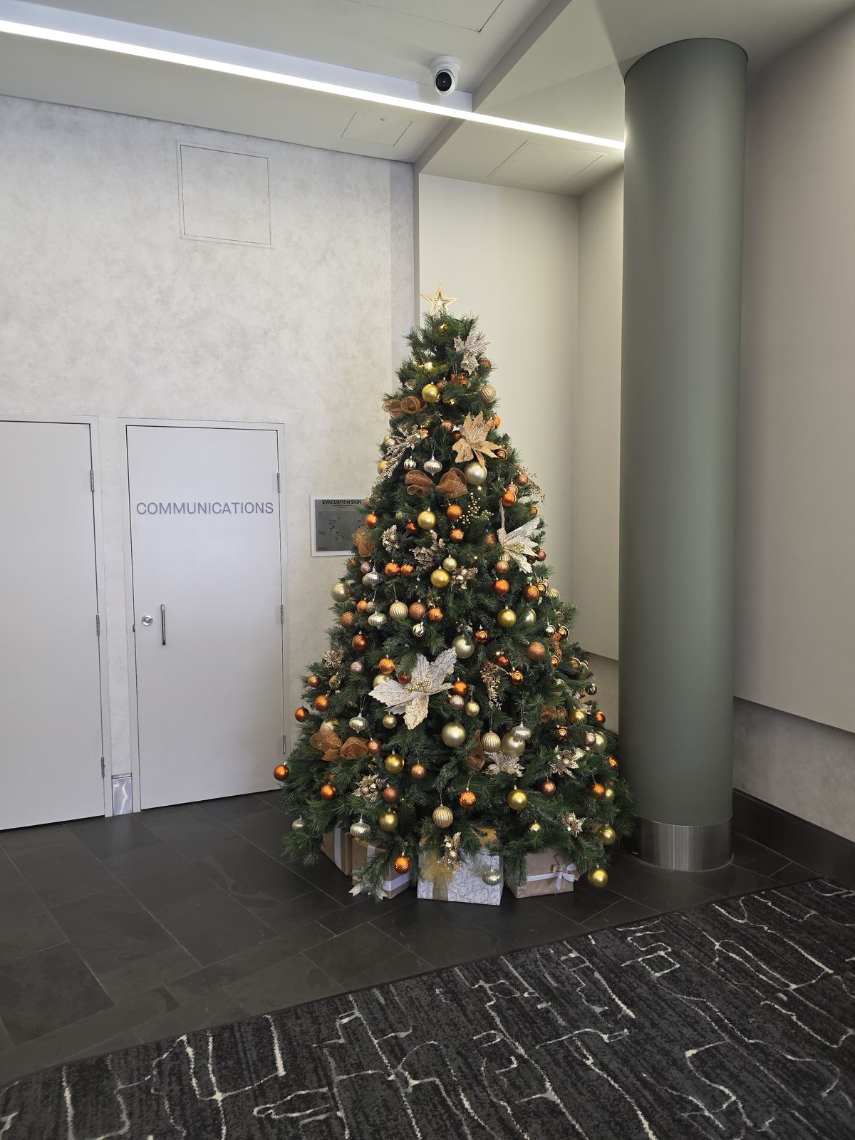 Gold themed tree in an office