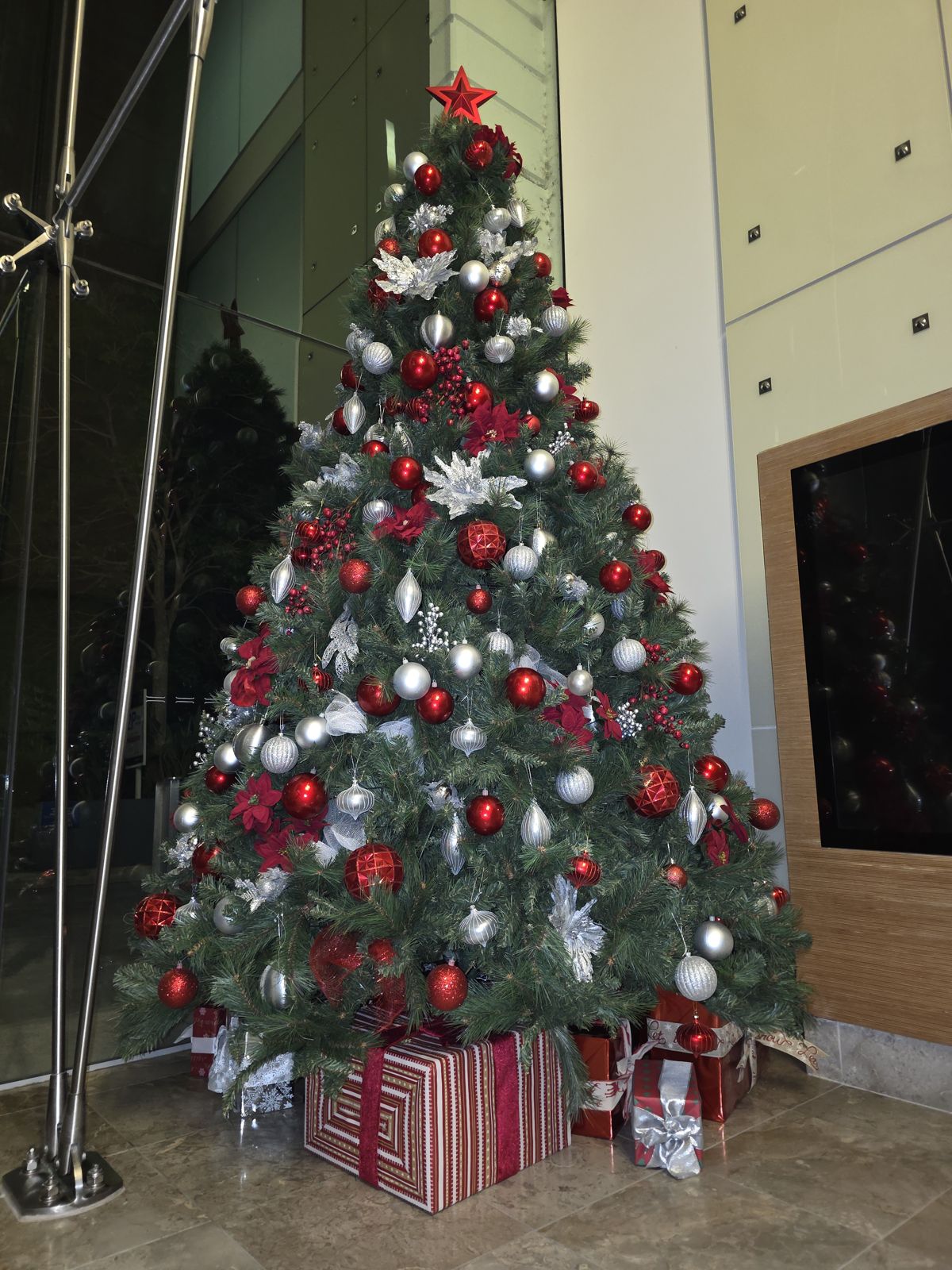 Richly decorated red and silver Christmas tree